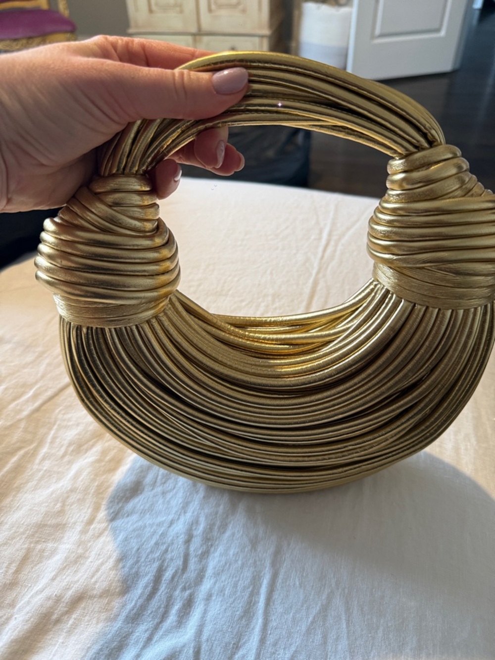 Unique Circular Wrapped Handle Clutch in Metallic Gold